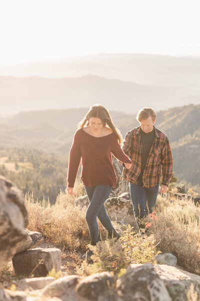 Idaho Wedding Photographer  Couple walks through the mountains holding hands