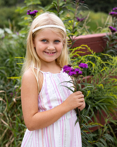 Image of girl with flowers outside