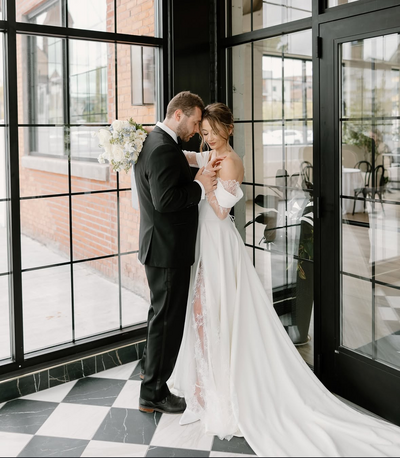 Bride and groom holding each other.