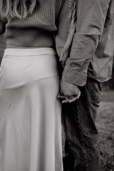 Romantic outdoor couple session with golden light and candid connection.