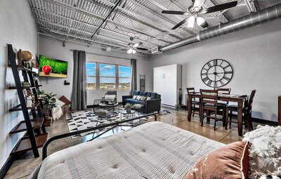 View of industrial modern space in this studio vacation rental condo in the historic Behrens building with a 5th floor view of downtown Waco, TX