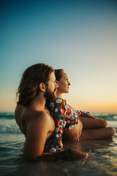 couples maternity session in the  water at the beach in st pete fl