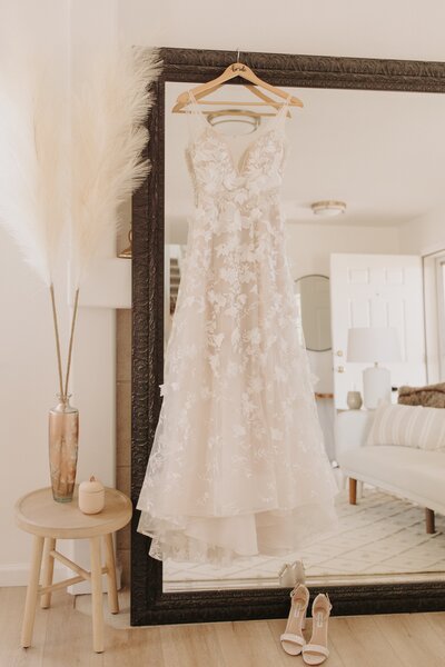 Berta Wedding Dress on a Mirror - Bre & Chris | Converted Basketball Court Wedding – Featured in Brides Magazine