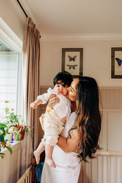 family with little boy thrown in the air during a family photography session