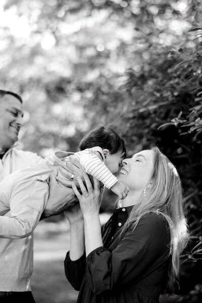 Nashville mom and two sons smiling in bedroom photo shoot