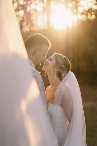 Adventurous couple embracing during sunset wedding in North Carolina