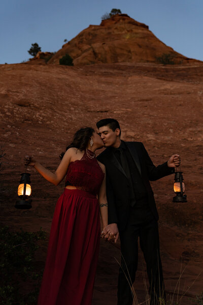Sabino Canyon engagement photo shoot couple standing in front of giant saguaro cactus.
