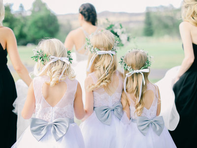 flower girls helping bride