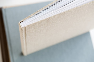 detail shot of the top of a fine art album. The album is made of a tan cover. 