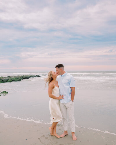 A couple kissing on the beach 