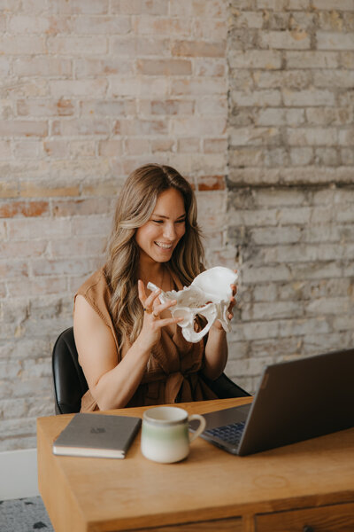 Christine Poulin Sitting in chair looking calm and happy