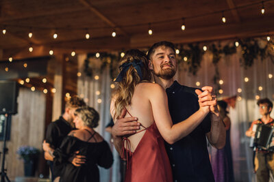 A couple dancing together at a wedding reception.