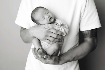 Fort Worth Newborn in Dad's Hands
