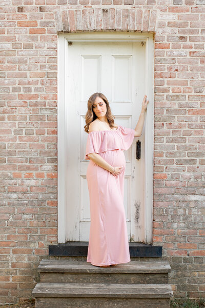Allaire State Park maternity photo shoot girl in pink maxi dress hand up