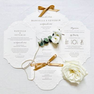 Bespoke luxury wedding stationery in gold and white designed by ECLAT Destination Weddings Vienna