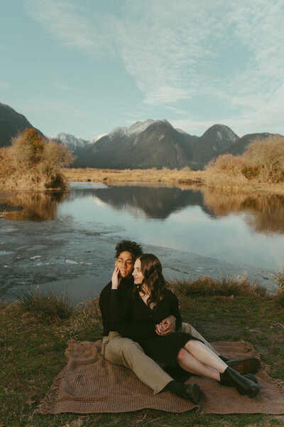 romantic whimsical and vintage engagement photo of a man kissing girl's hand