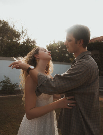 Engaged couple posing together in a stylish Atlanta city setting