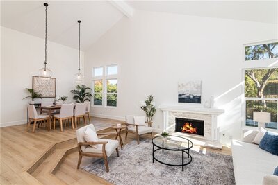 Photo of neutral living space with accent chairs home staging