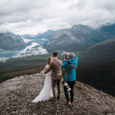 Adventure elopement photographer taking a picture of a couple