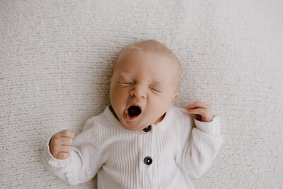 Newborn baby yawning.