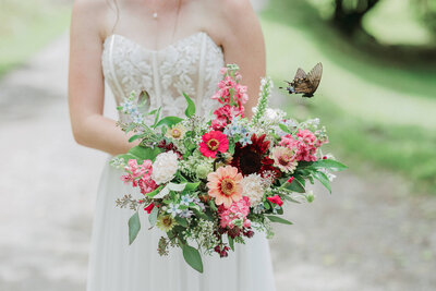 Wedding bouquet detail shot of a butterfly at Hidden River Events near Asheville