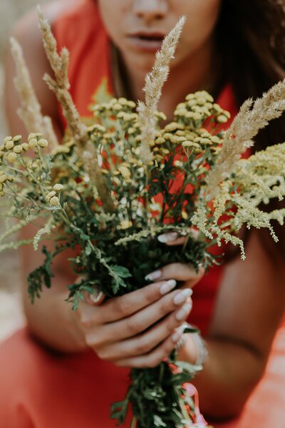 kaboompics_Woman in a red dress with flowers outdoors
