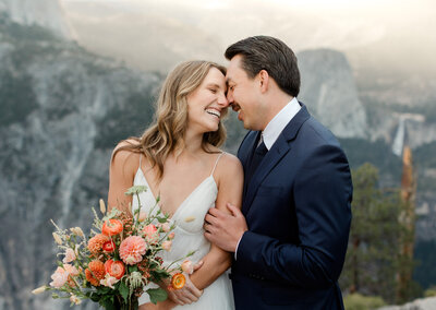 A bride and groom walk through Tuolumne Meadows in Yosemite National Park. 