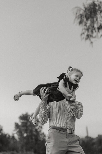Corey Combs holding his daughter in Manchester, Vermont