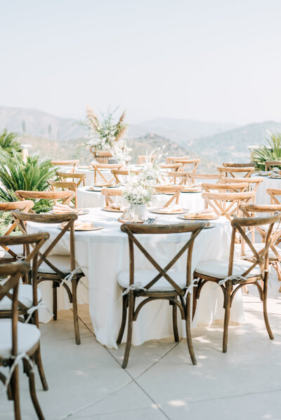 wooden chairs setup for the wedding reception