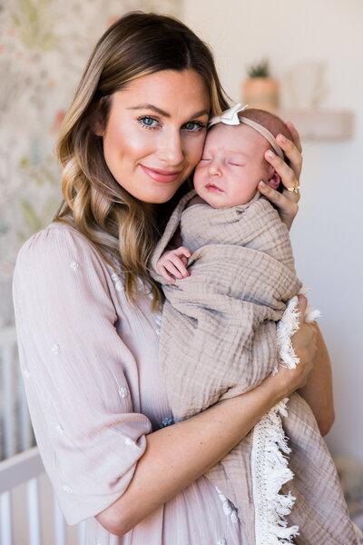 mom and newborn baby face to face in lifestyle newborn session