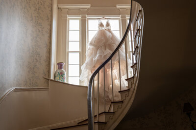 A dress  handing in a window 