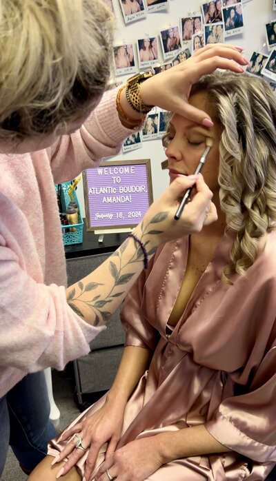 a woman having her make up session