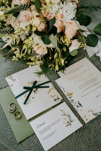 wedding invitation suite for hawkstone hall wedding with floral details and vellum wrap