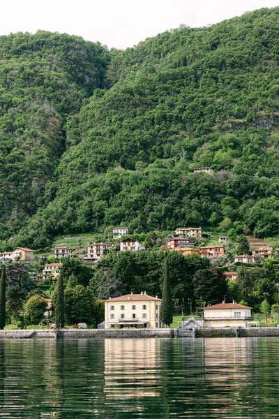 An aerial drone photo of villa aura del lago on lake como in Italy