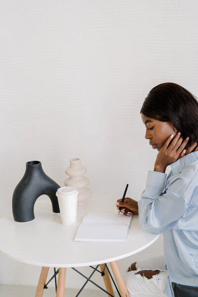 woman writing in journal