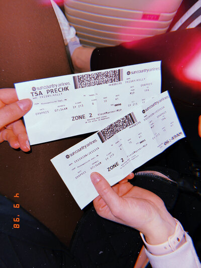 Photo of plane tickets by Duluth wedding photographer, Kelly Friday Photography. 