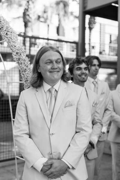 Groom watching bride walk down the aisle at Starland Yard in Savannah, GA