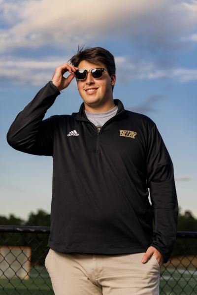 A guy taking his senior portrait in  Columbia, South Carolina