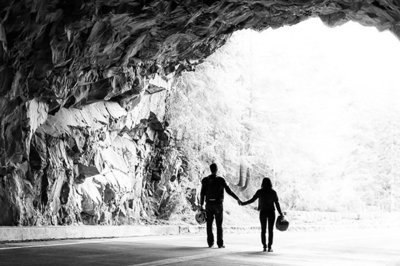 silhouette of couple holding hands in rocky tunnel, Mt Rainier National Park | Meg Sivakumar Photography