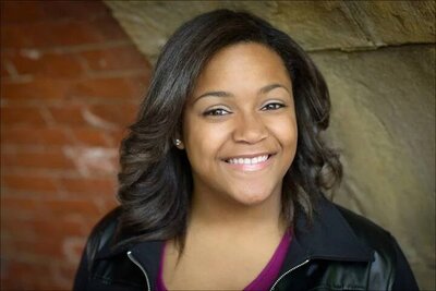 Smiling headshot portrait of young professional — NJ studio.

