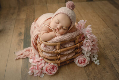 newborn baby posed in bamboo basket, hamilton, ON
