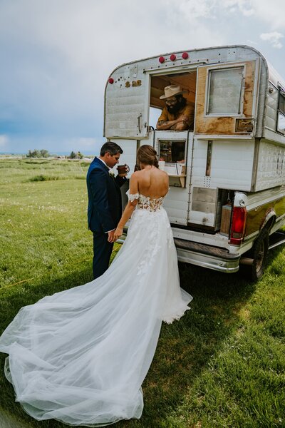 Bozeman wedding couple grabs a coffee from local vendor, Roly Poly Coffee.