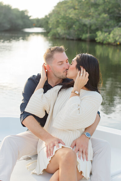 Orlando Couples photographer captures couple kissing after their proposal on a boat