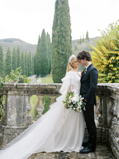 bride and groom on steps at Villa Cetinale