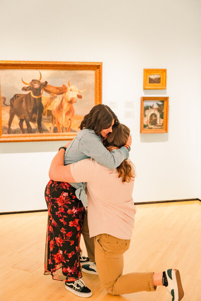 Surprise engagement proposal in downtown Charlottesville VA, at the museum, capturing a joyful moment