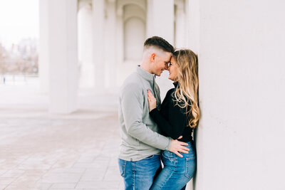 couple smiles foreheads together hand in hand during engagement session by winx photo knoxville wedding photographer