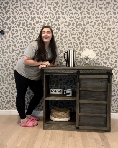 Alexis standing next to a coffee bar she built