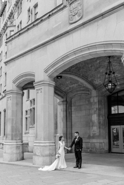 Bride and groom walk up memorial steps at their DC wedding