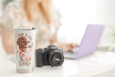 tumbler of a book lover during branding pictures in Manassas,VA