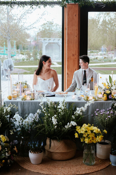 Brides at wedding sweetheart table